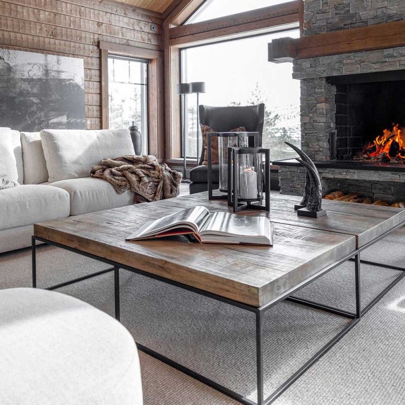 Rectangular coffee table with black metal legs and brown wooden tabletop