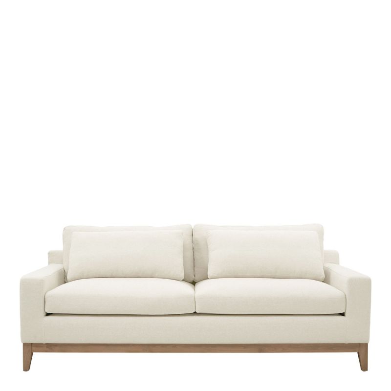 Scandi style sofa with white linen covers and wooden base