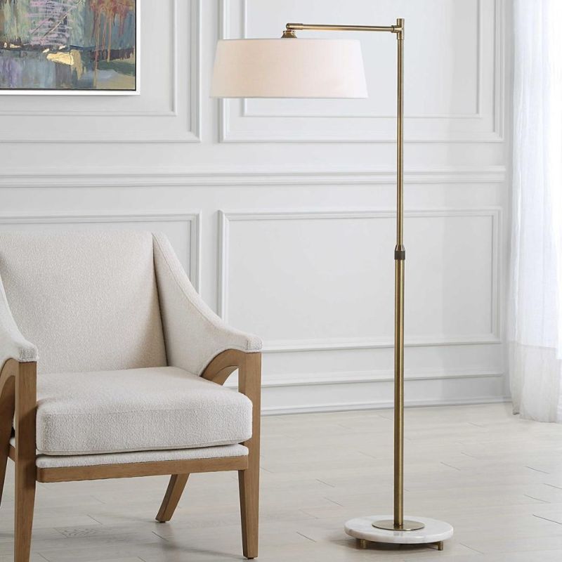 Delicate gold floor lamp with marble base and white shade