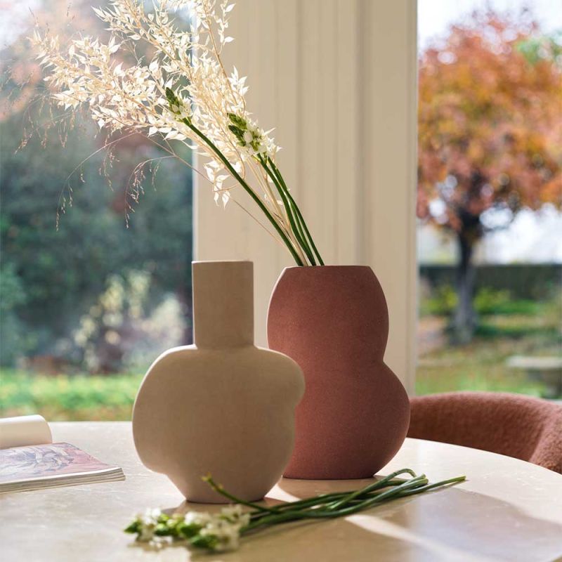 Charming organic shape curved vase in beige