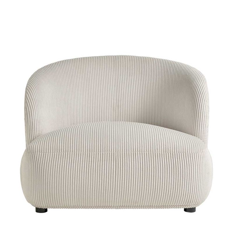 cream rounded armchair in soft ribbed fabric