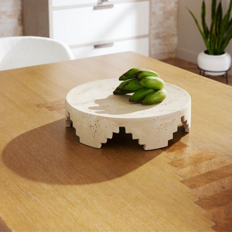 Round, travertine, table centrepiece with Aztec cut-outs