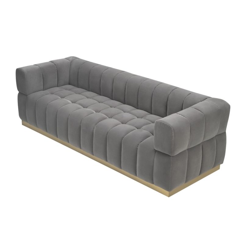 A stylish deep buttoned sofa with a gorgeous grey velvet upholstery and brushed brass base