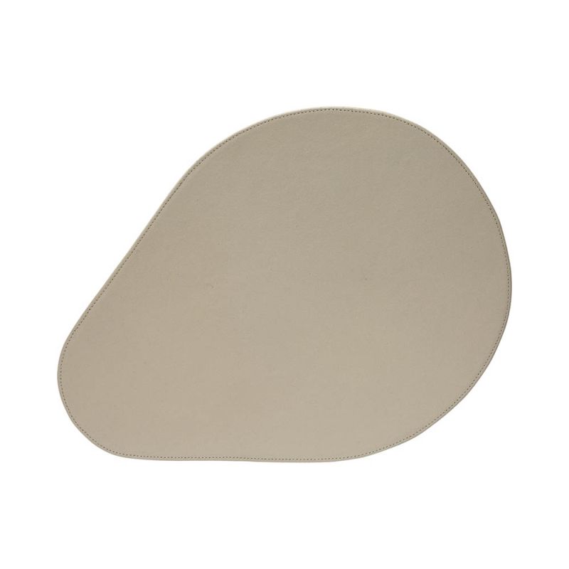 Organic shaped placemat in neutral colour finish