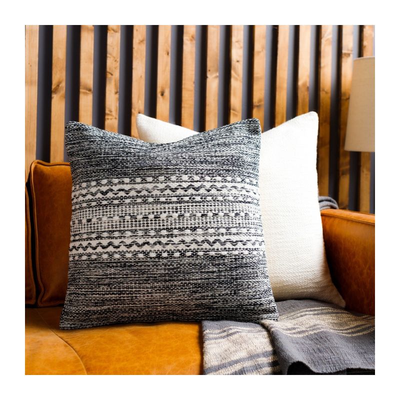 Add comfort and style to your space with the Ethan Hand Woven Cushion. Unique textures and vibrant colors for your perfect home decor accent!