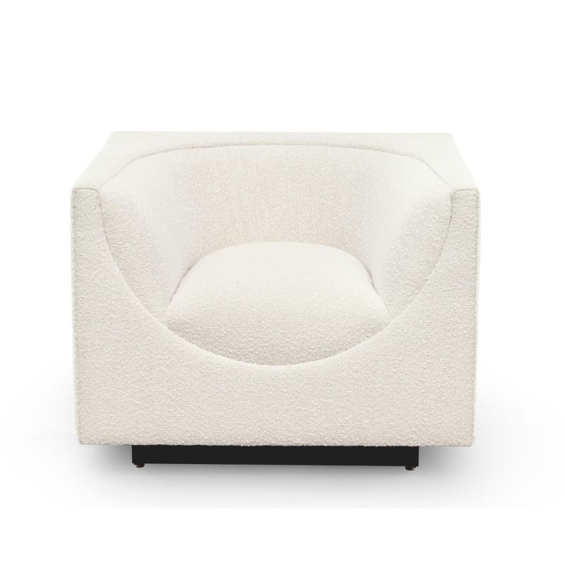 Sand chair with curvaceous tailoring in its dipped seat design