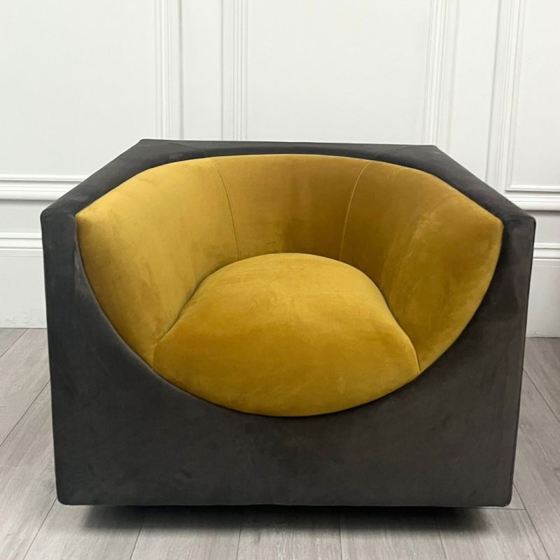 Mustard chair with curvaceous tailoring in its dipped seat design