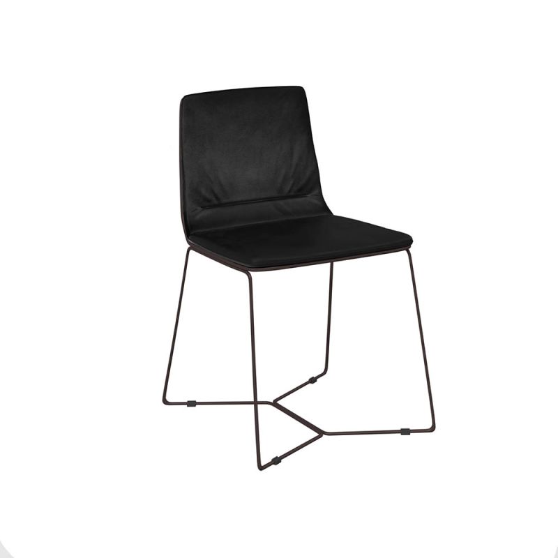 Svelte, minimal silhouette dining chair with thin legs and velvety texture