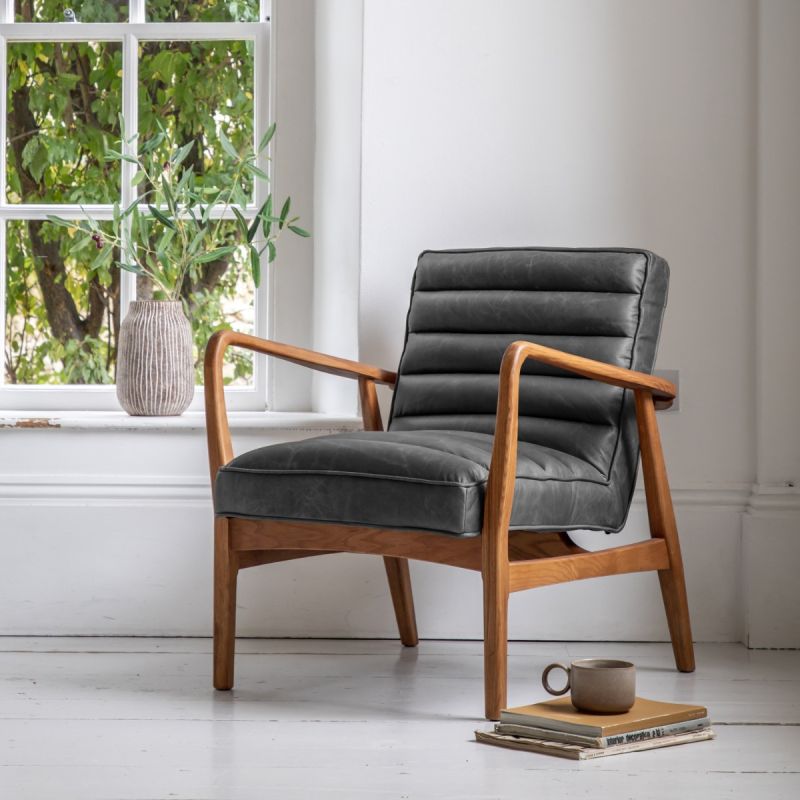 Leather armchair with deep ridging and wooden frame