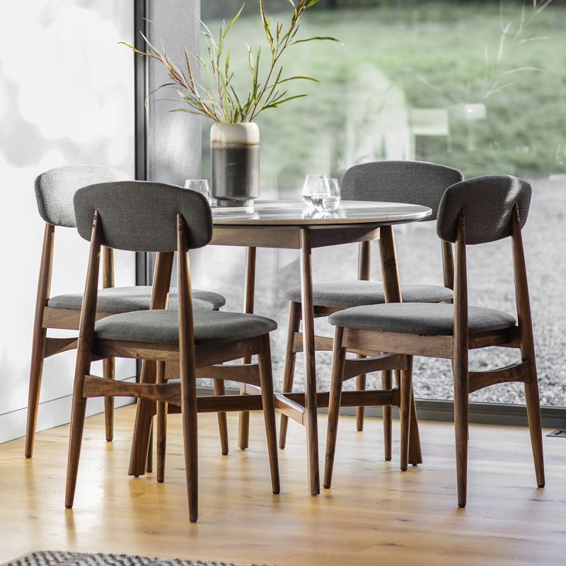 Round dining table in walnut stained wood with marble top