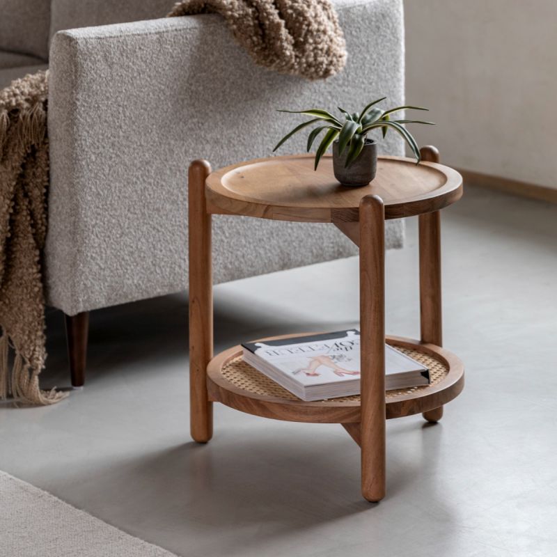 Circular wooden side table with lower rattan shelf