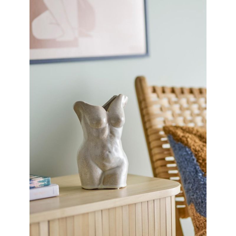 Stone sculpted vase in shape of woman's torso