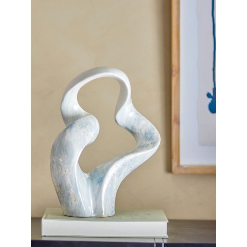 blue and white sculpture in curved design