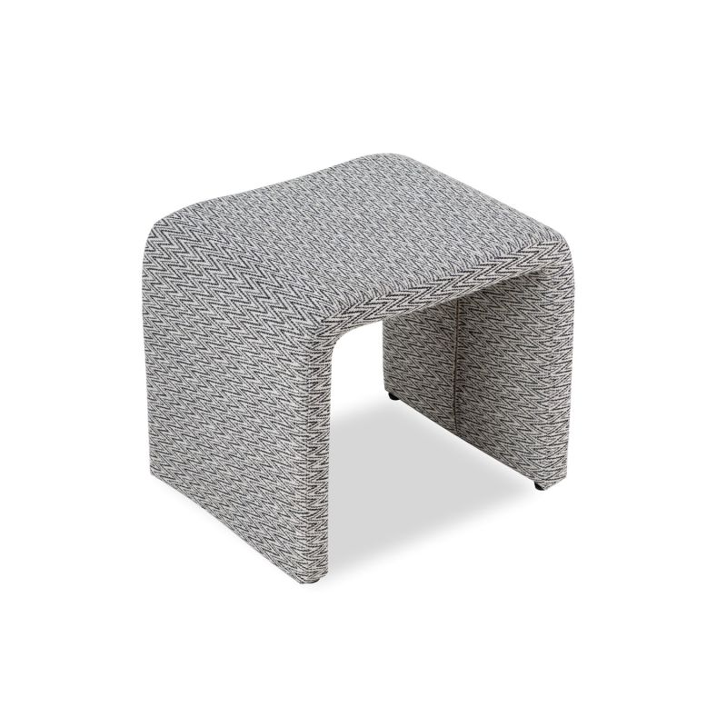 A statement stool with an abstract pattern upholstery