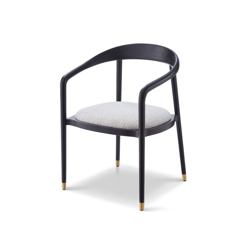 rounded black minimalist dining chair with brass caps on the feet and boucle seat