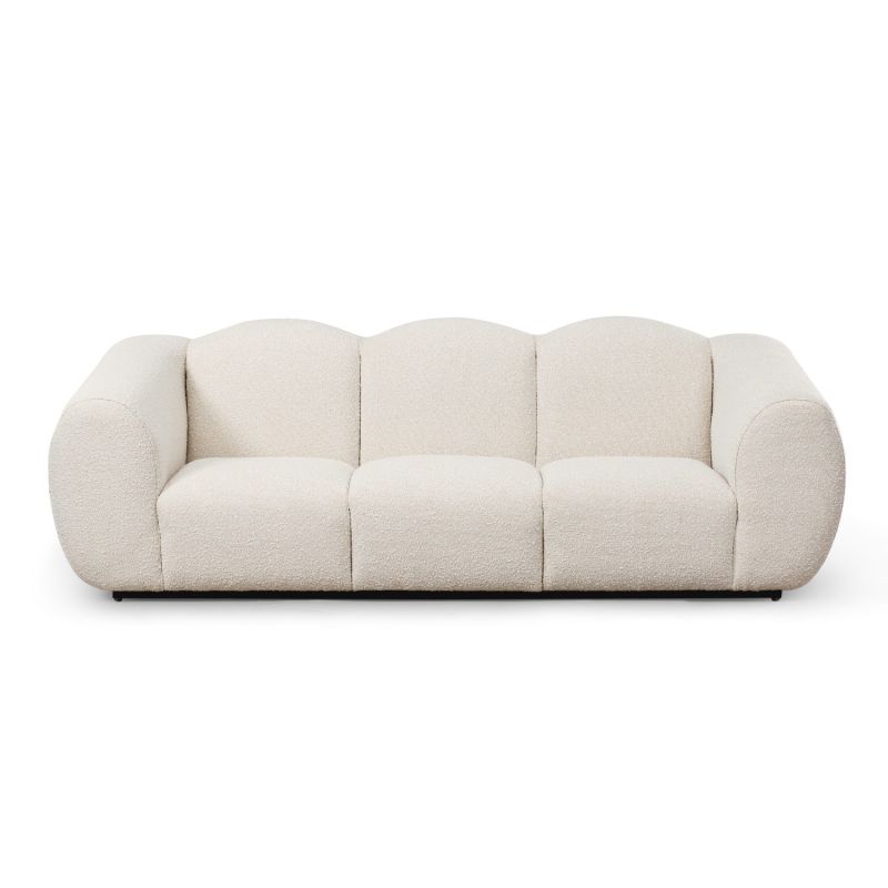 A beautiful sofa by Liang & Eimil with a luxury boucle upholstery and stylish shape