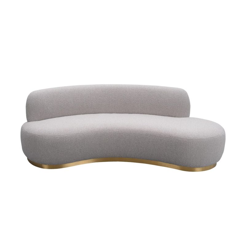 A luxury curved sofa by Liang & Eimil with a grey boucle upholstery and brushed brass base