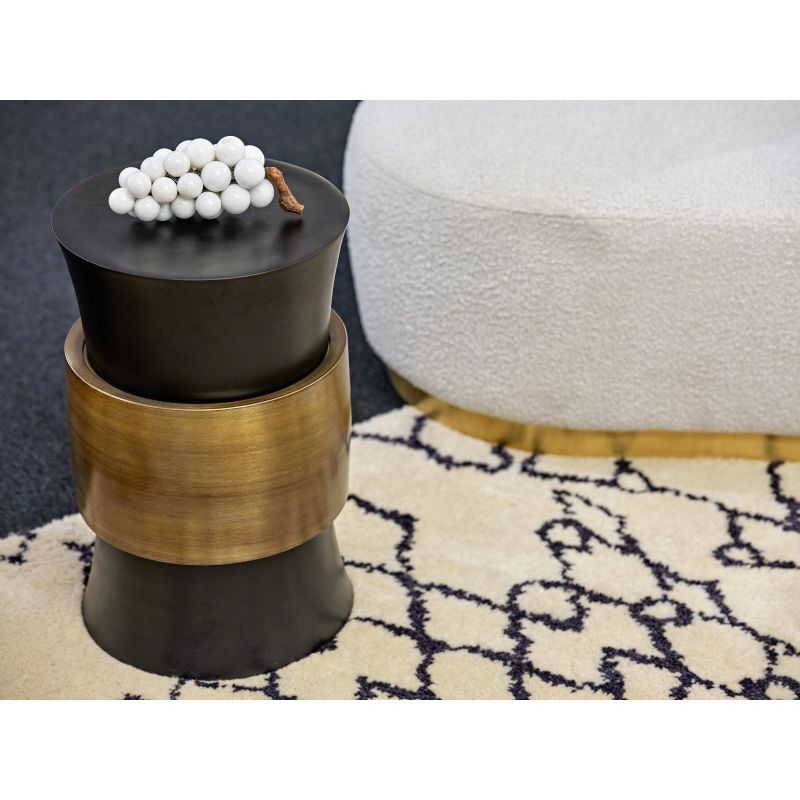 Black side tables with brushed brass detail around the middle