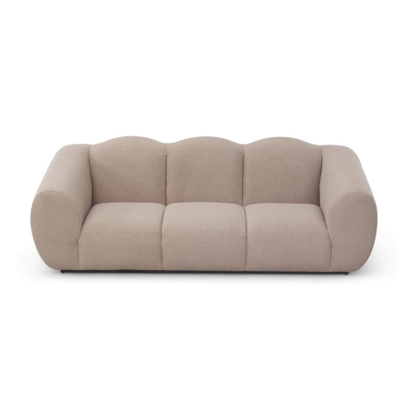 A luxury sofa by Liang & Eimil with a beautiful boucle upholstery and stunning shape