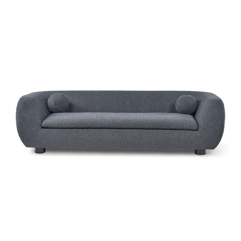 A contemporary sofa with two ball scatter cushions and a dark grey upholstery