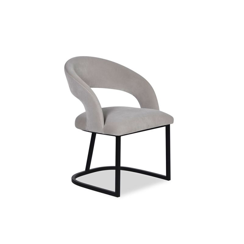 Curved back dining chair in grey velvet with black base frame