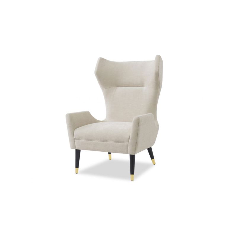 A sophisticated armchair by Liang & Eimil with a classic design and beige upholstery