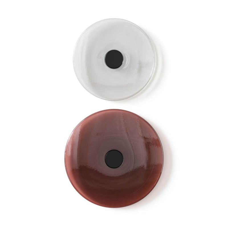 Round disc wall hangers, one clear and one red