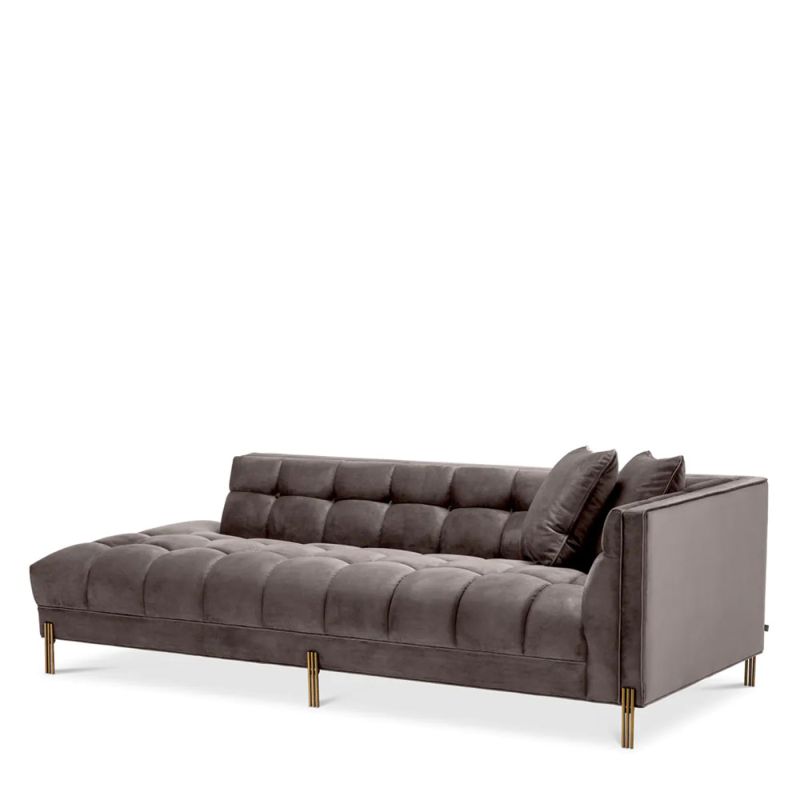 Grey velvet corner sofa with brass finish accents