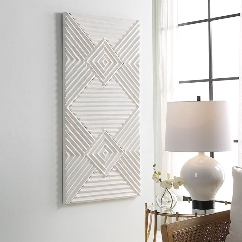 A gorgeous geometric wall artwork with a white washed finish