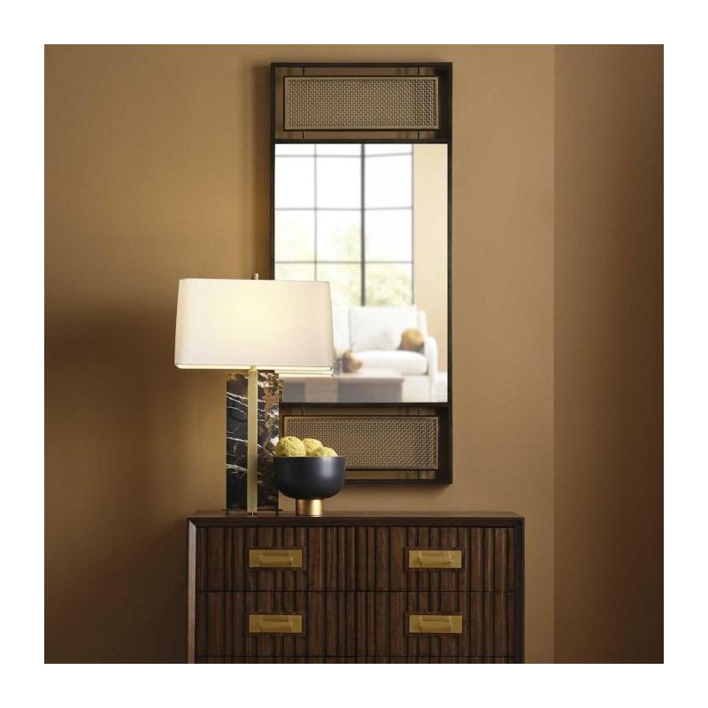 Rectangular wall mirror with black frame and brown mesh panelling