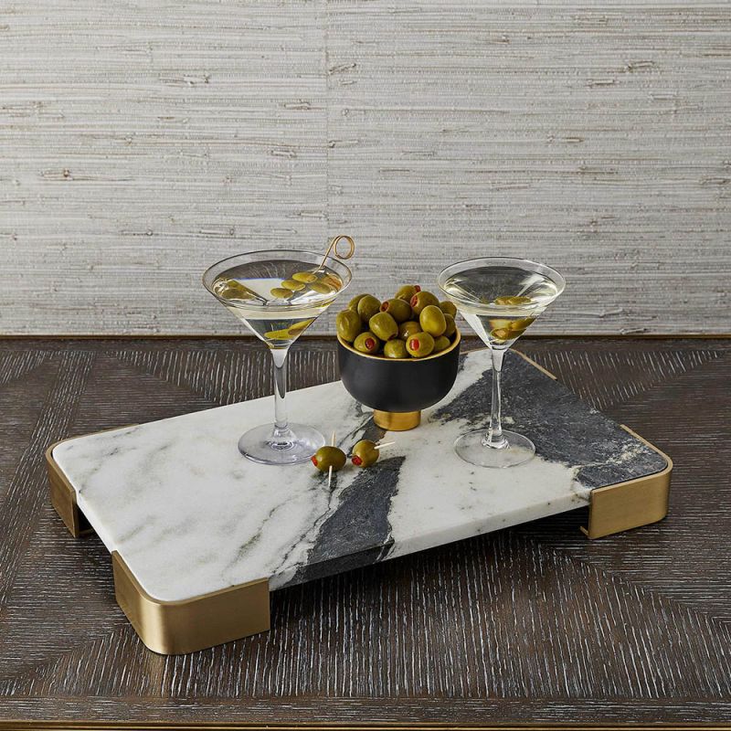 White and black marble slab tray elevated on brass feet