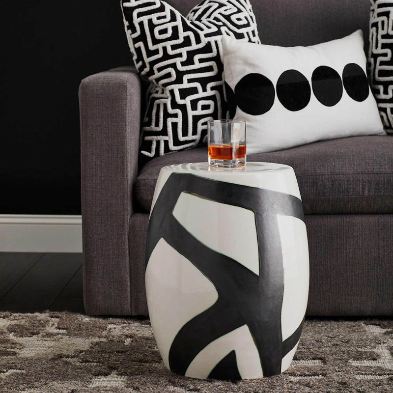 Elegant black and white stool/side table with abstract stroke design