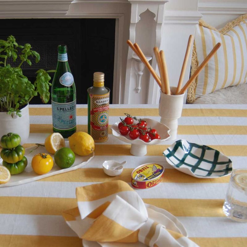 Tablecloth with colourful stripe design and ruffled edges