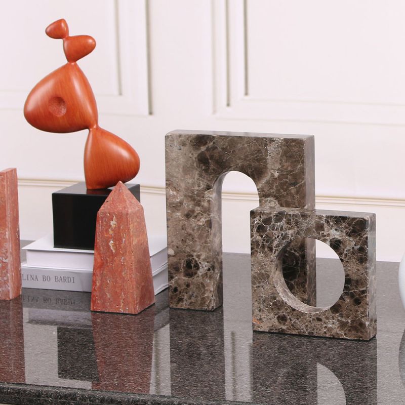 Rich brown marble sculpture in elegant curve design