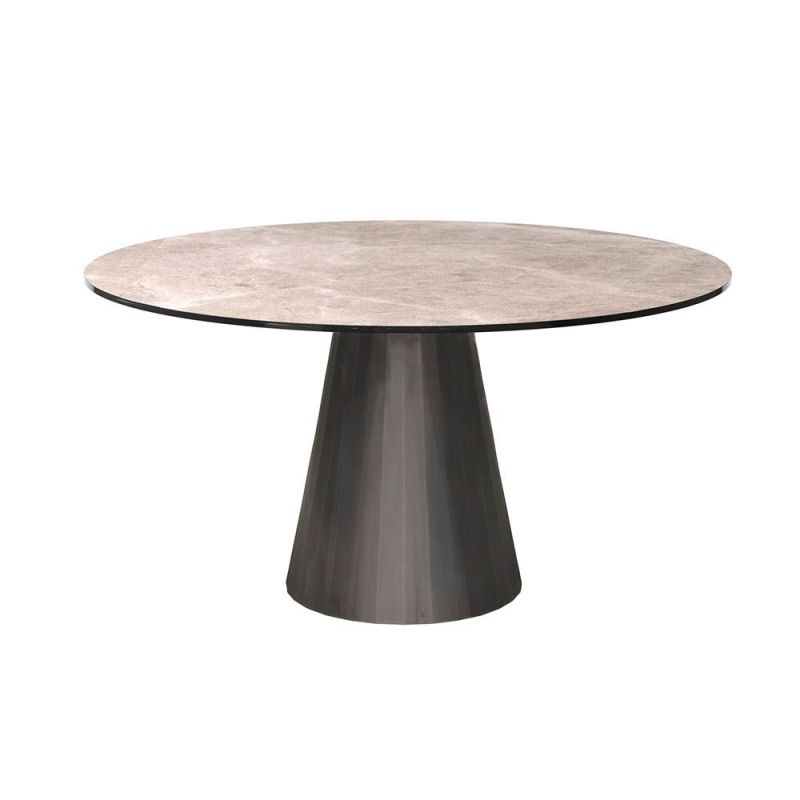 Round and tapered dining table with artisanal central table leg