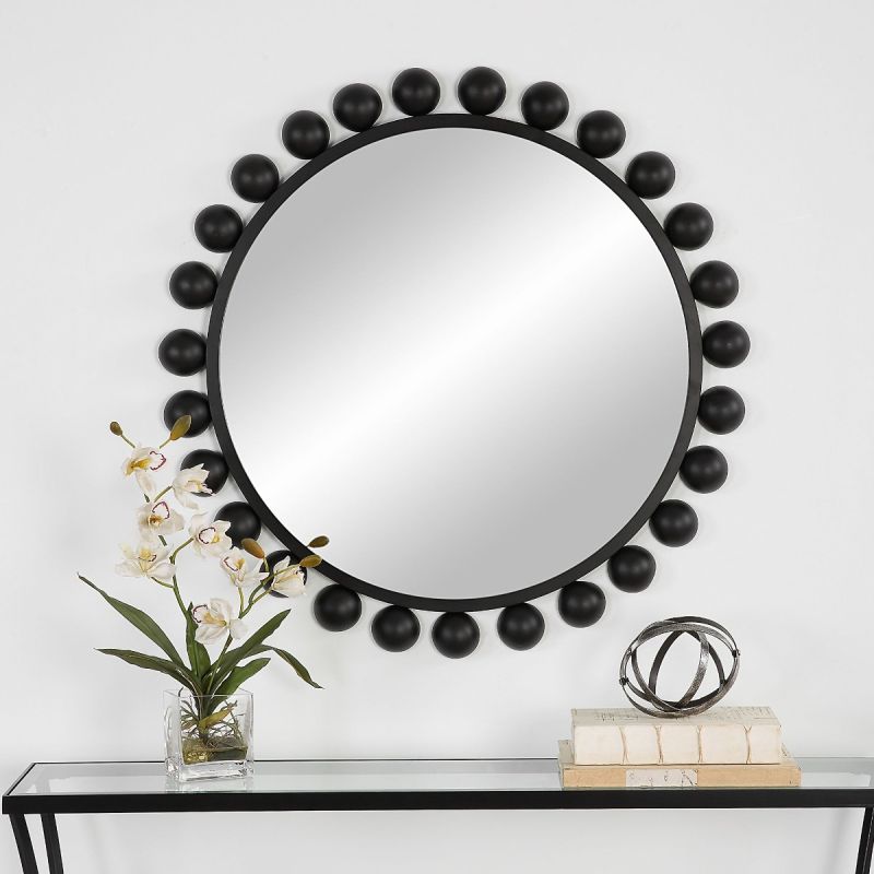 Elevate your decor with the Spheres Mirror in Black. Its modern design adds a chic touch to any space, reflecting style and sophistication.