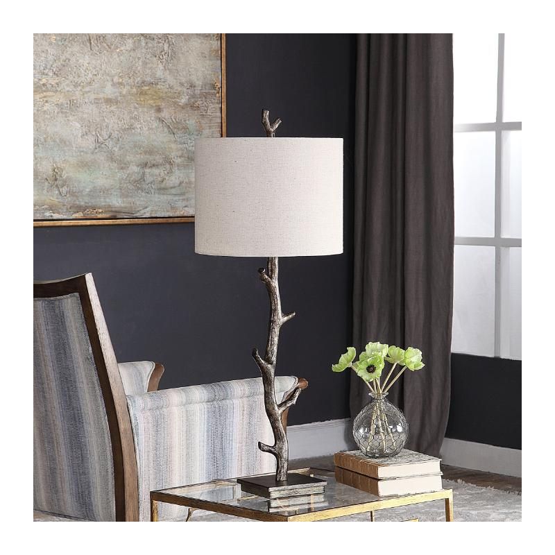 This rustic table lamp features a deep bronze finish with silver undertones and an off-white linen shade