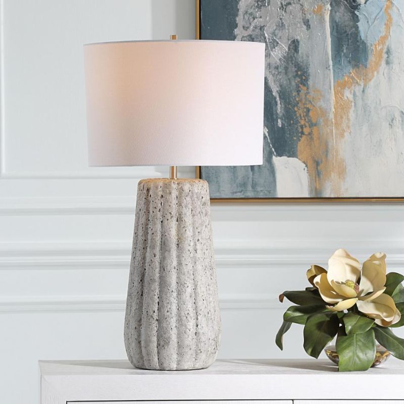 This ceramic lamp features a weathered stone finish, brushed nickel accents, and a soft off-white linen shade, bringing timeless elegance and classic sophistication to any space.