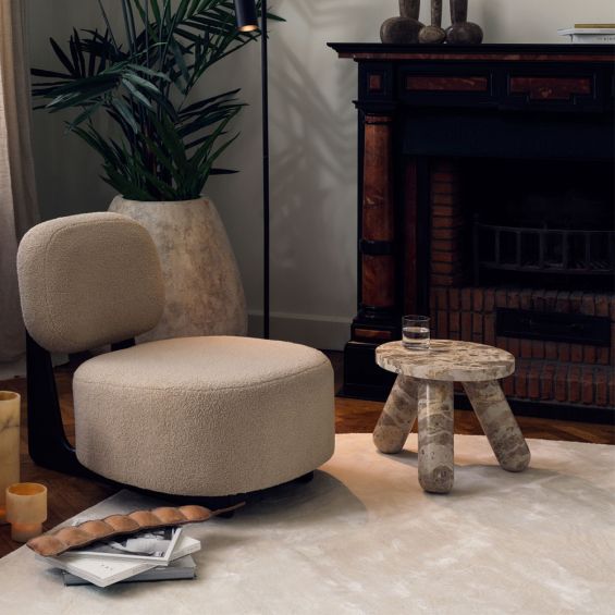 Brown marble side table with three legs