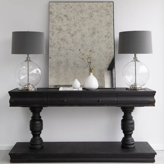 stunning black stained wooden console table with two carved supportive beams