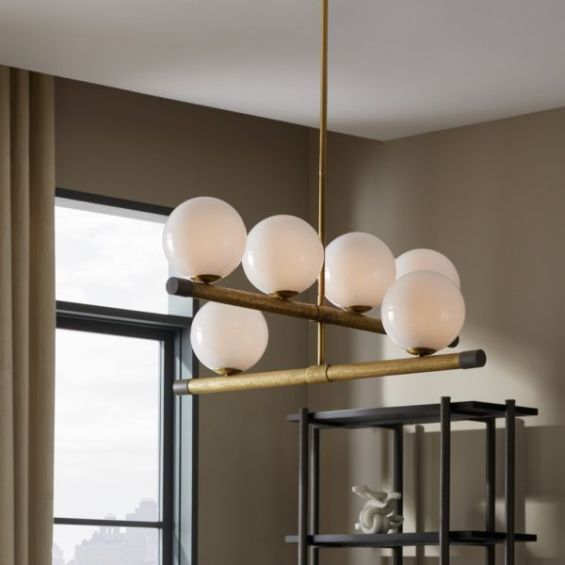 Chandelier with orb shades along brass poles