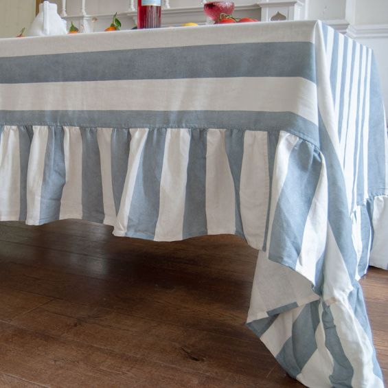 Tablecloth with colourful stripe design and ruffled edges