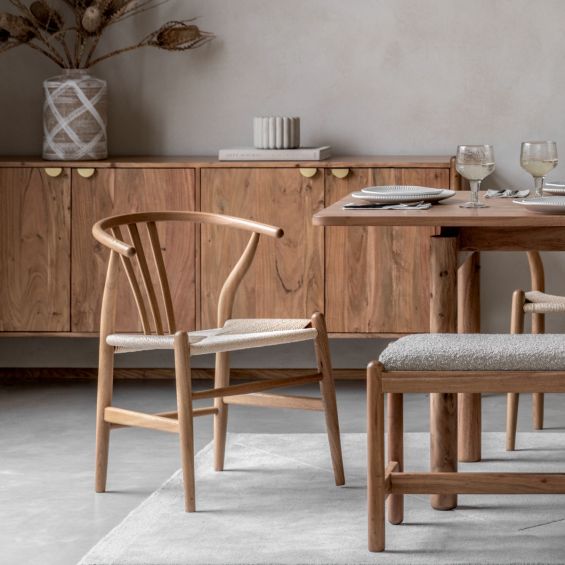 Wishbone back dining chairs with deeply curved back and distinctive hand woven seat