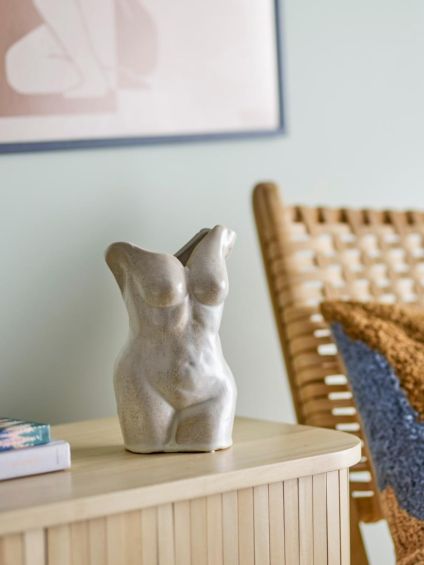 Stone sculpted vase in shape of woman's torso