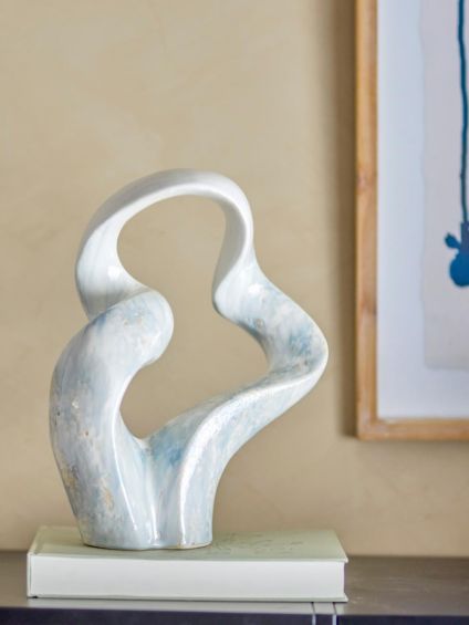 blue and white sculpture in curved design