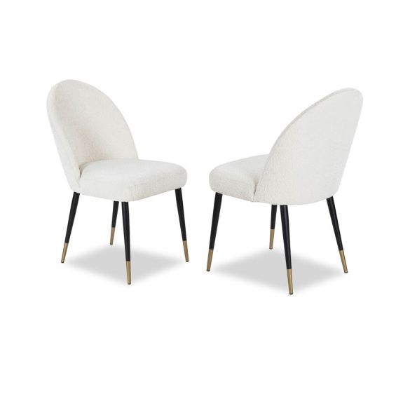 Rounded back dining chair with black legs, brass feet caps and boucle upholstered