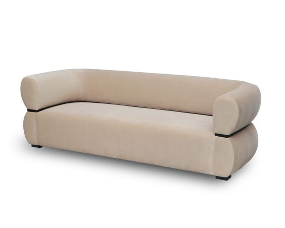 A luxury sofa by Liang & Eimil with a soft velvet upholstery