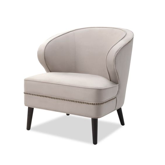 Velvet beige armchair boasting beautiful curves, tapered wenge wood legs and nail head trim accent