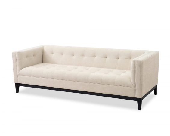 A luxury sofa by Liang & Eimil with a sophisticated design and beautiful beige upholstery