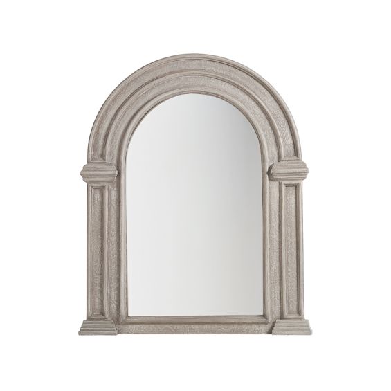 A timelessly stylish wall mirror with an arched wooden frame